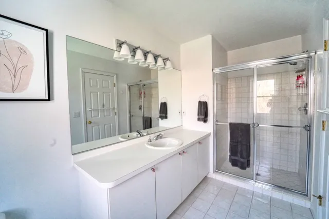 a bathroom with a sink and mirror