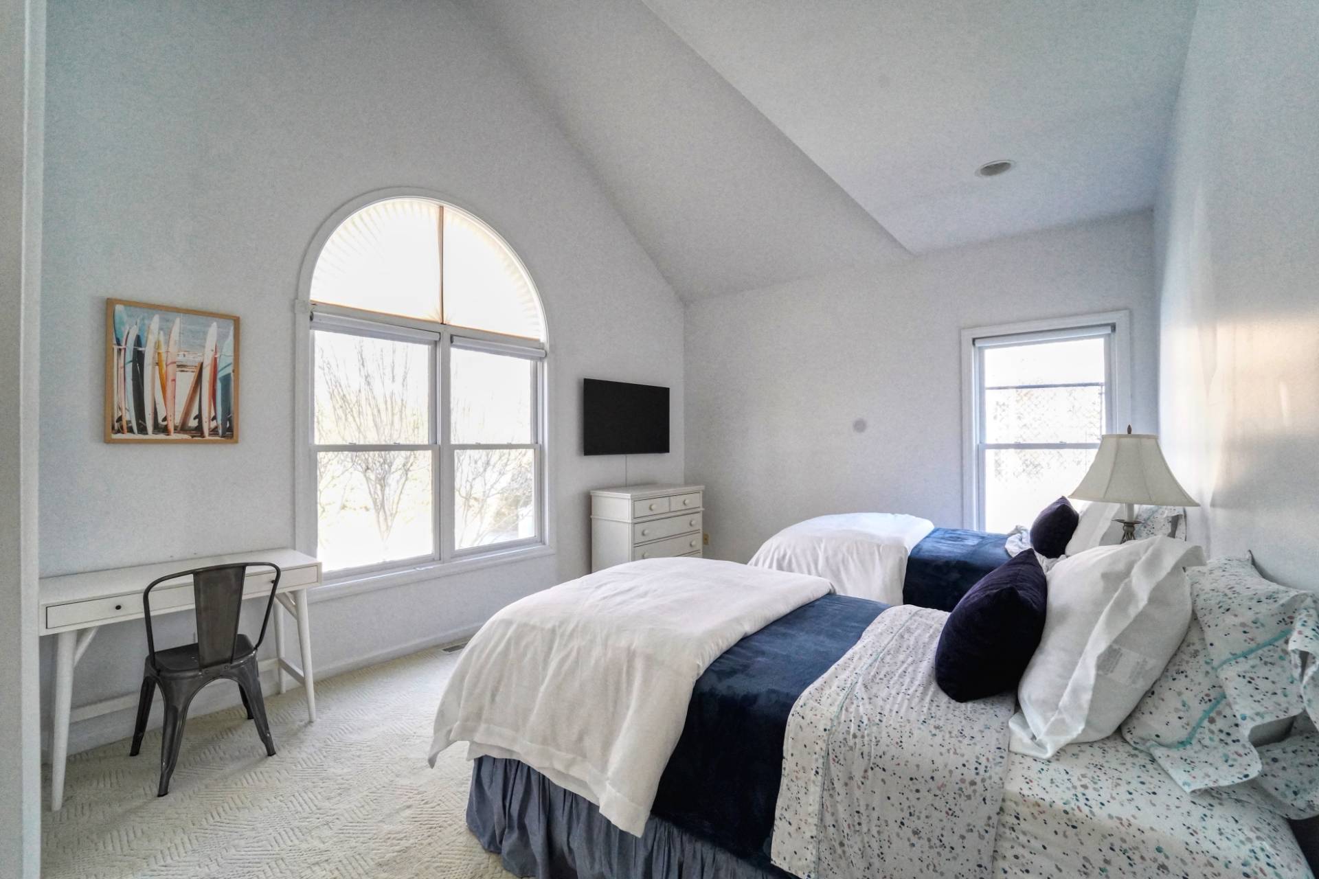 7 Plume Grass Way Westhampton, NY 11977 - Photo 19 of 23 a bedroom with a bed and a large window