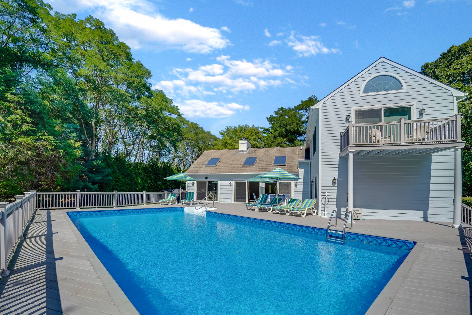 7 Plume Grass Way Westhampton, NY 11977 - Photo 22 of 23 a view of house with swimming pool outdoor seating