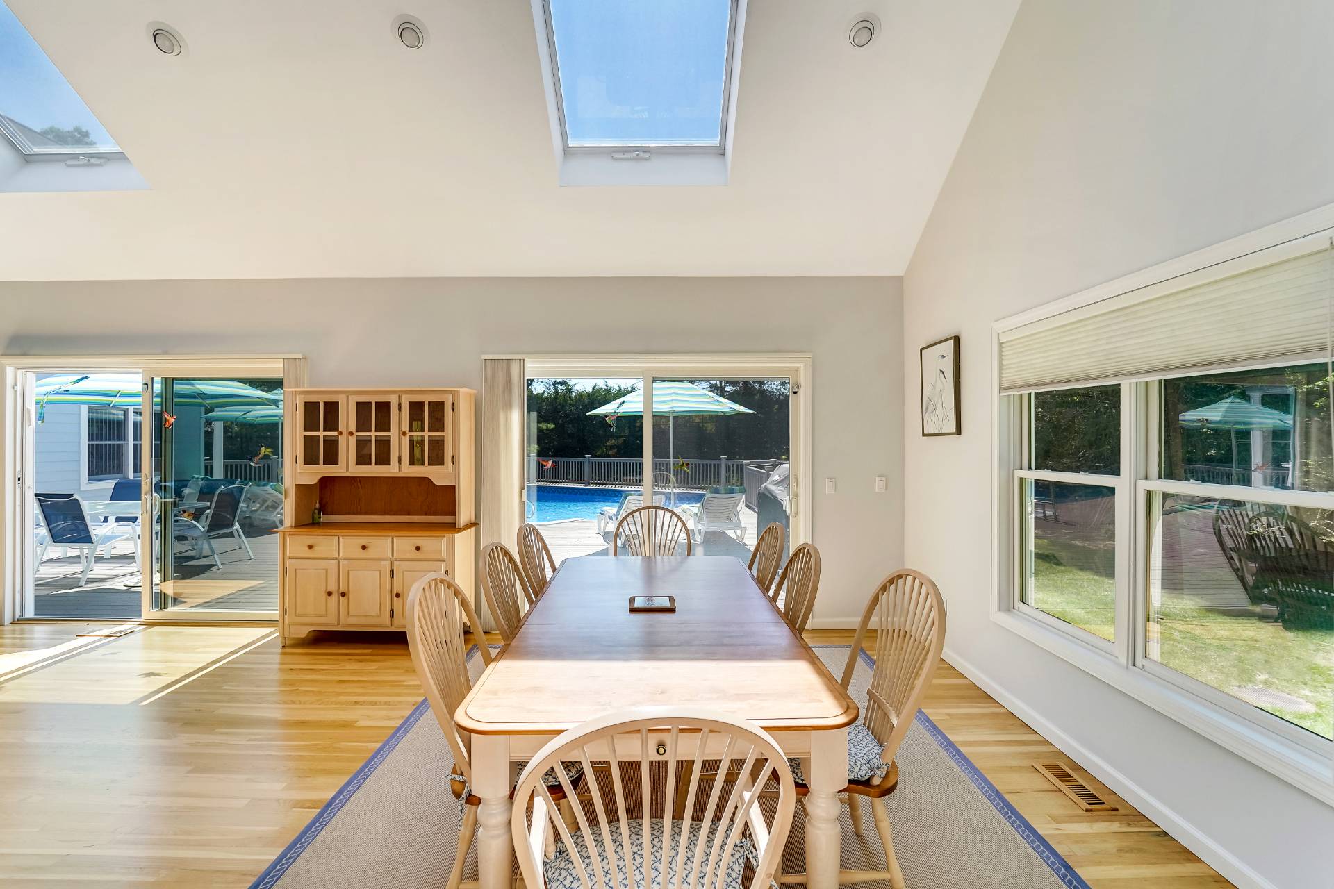 7 Plume Grass Way Westhampton, NY 11977 - Photo 5 of 23 a view of a dining room with furniture wooden floor and windows