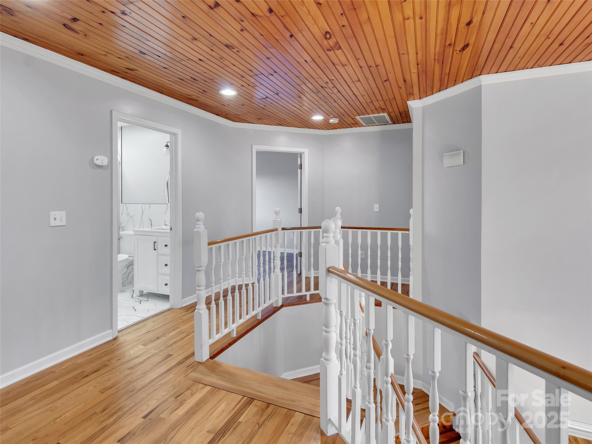 235 Loop Road Clyde, NC 28721 - Photo 8 of 21 a view of staircase with wooden floor and stairs