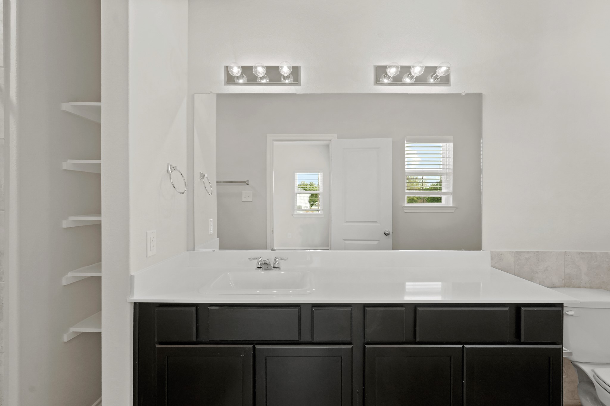 1407 Acorn Meadow Street Houston, TX 77067 - Photo 11 of 22 a bathroom with a sink and a mirror
