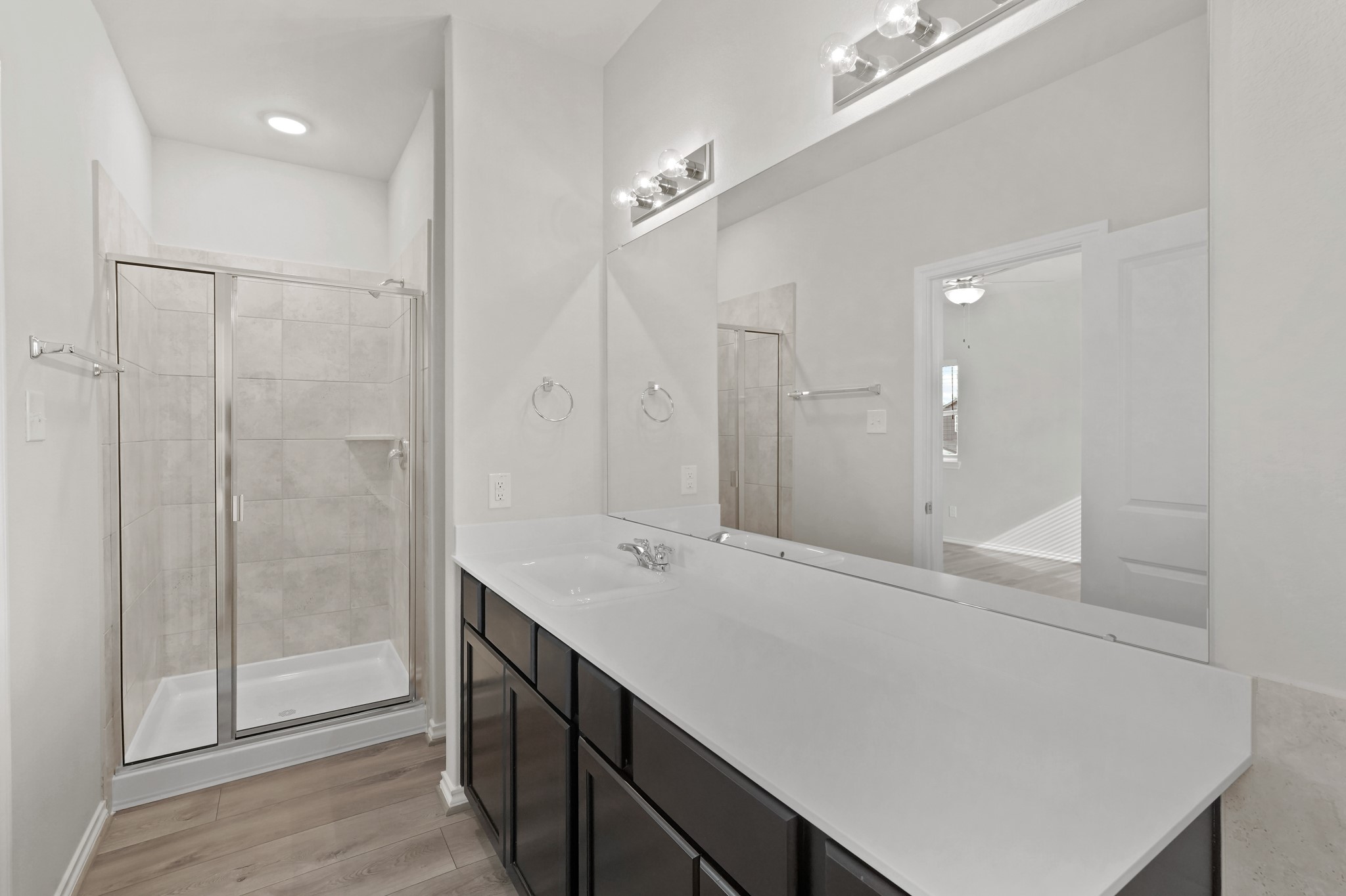 1407 Acorn Meadow Street Houston, TX 77067 - Photo 12 of 22 a spacious bathroom with a shower sink and mirror