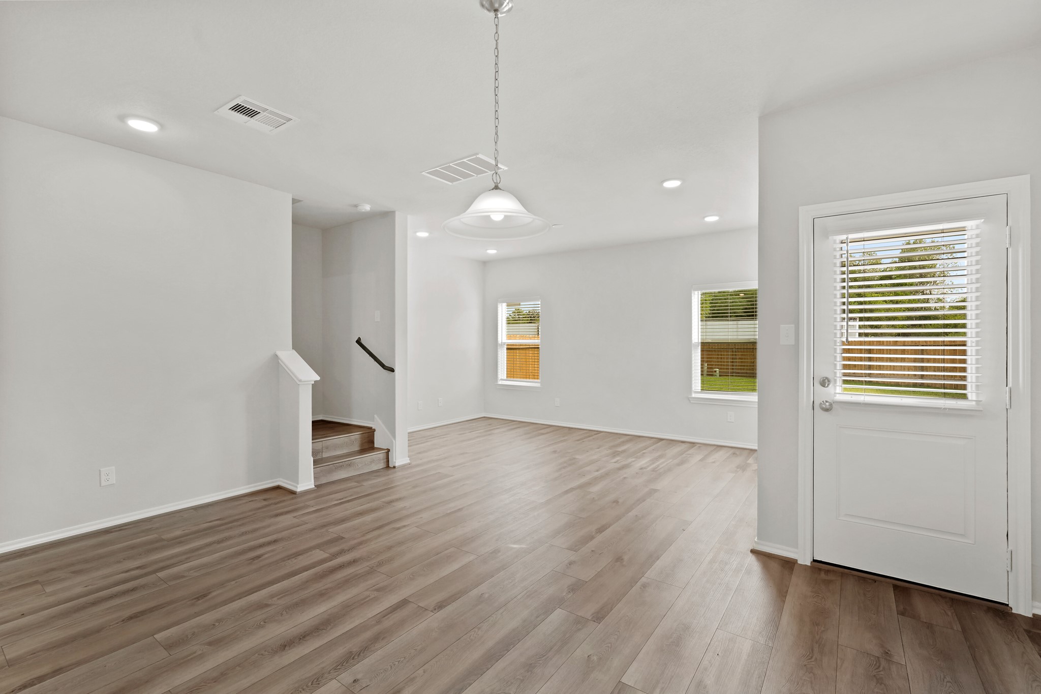 1407 Acorn Meadow Street Houston, TX 77067 - Photo 3 of 22 a view of empty room with wooden floor and window