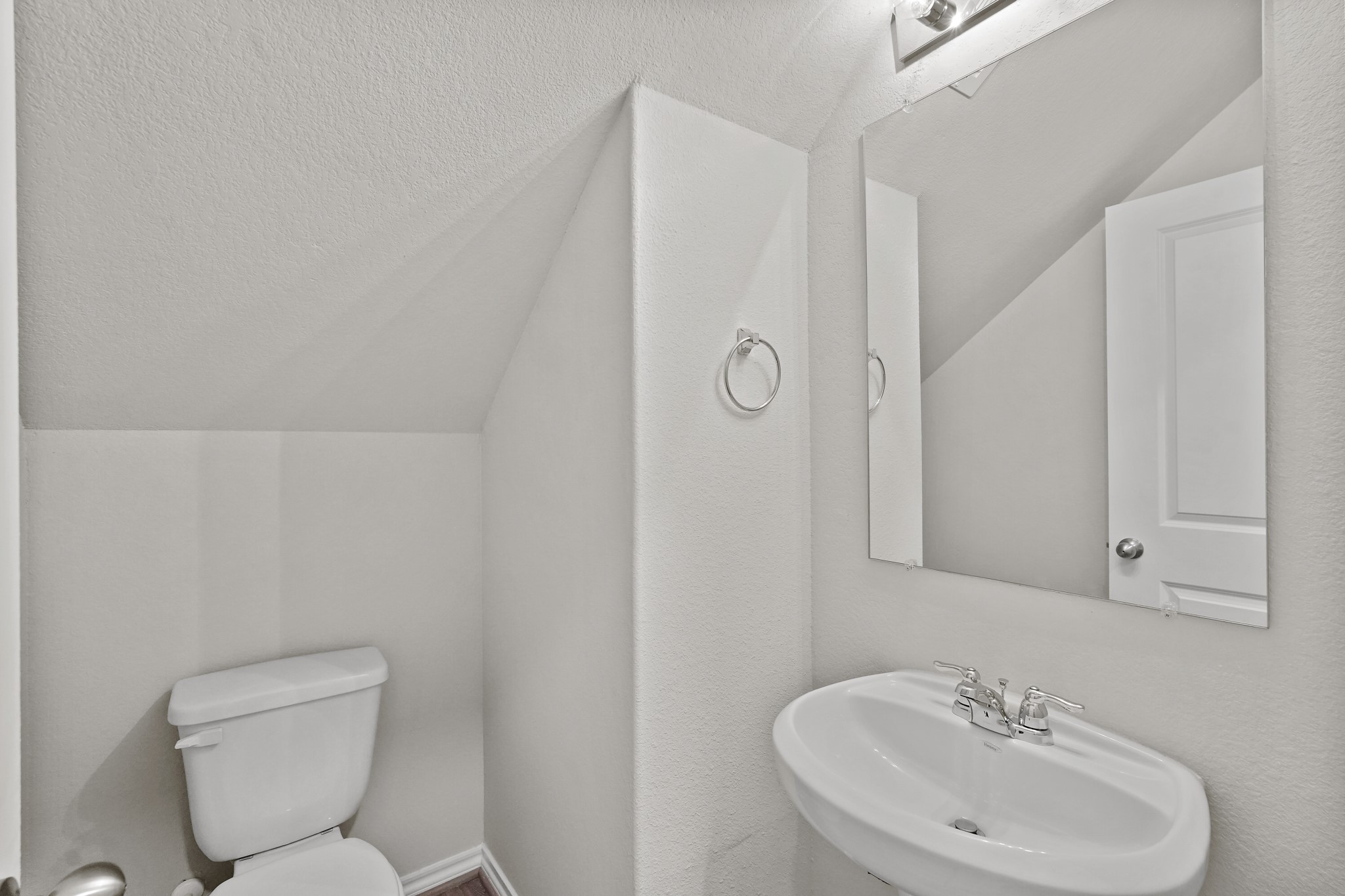 1407 Acorn Meadow Street Houston, TX 77067 - Photo 10 of 22 a bathroom with a toilet sink and mirror