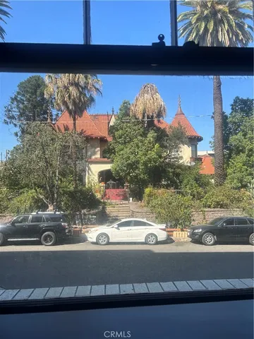 a view of a room with wooden floor and pool table