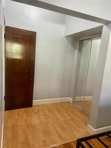 a bedroom with a bed and a mirror