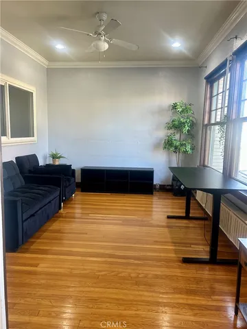 a living room with furniture and a pool table