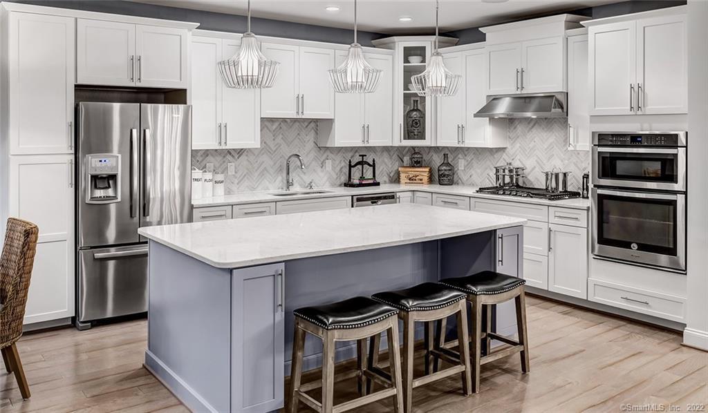 9 Highridge Road, Unit 146 Middlebury, CT 06762 - Photo 1 of 1 PLEASE NOTE- THis is a Model Home Denton with similar cabinets to be installed & Quartz counters. The island will be white not gray