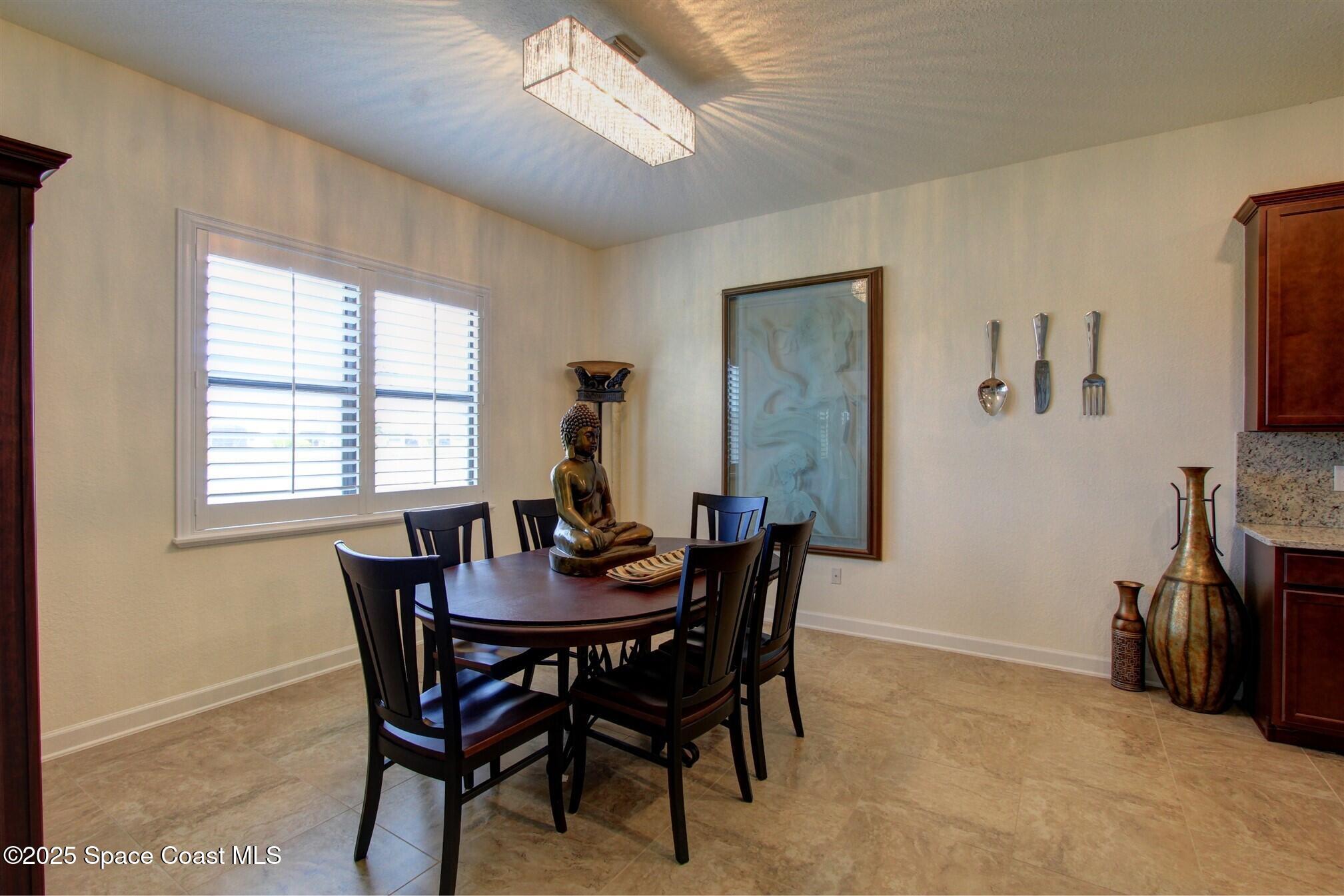 2542 Chapel Bridge Lane Melbourne, FL 32940 - Photo 16 of 44 a view of a dining room with furniture