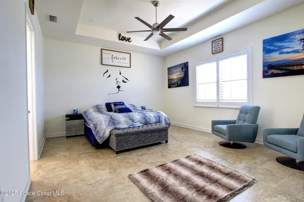 a bedroom with furniture and a window