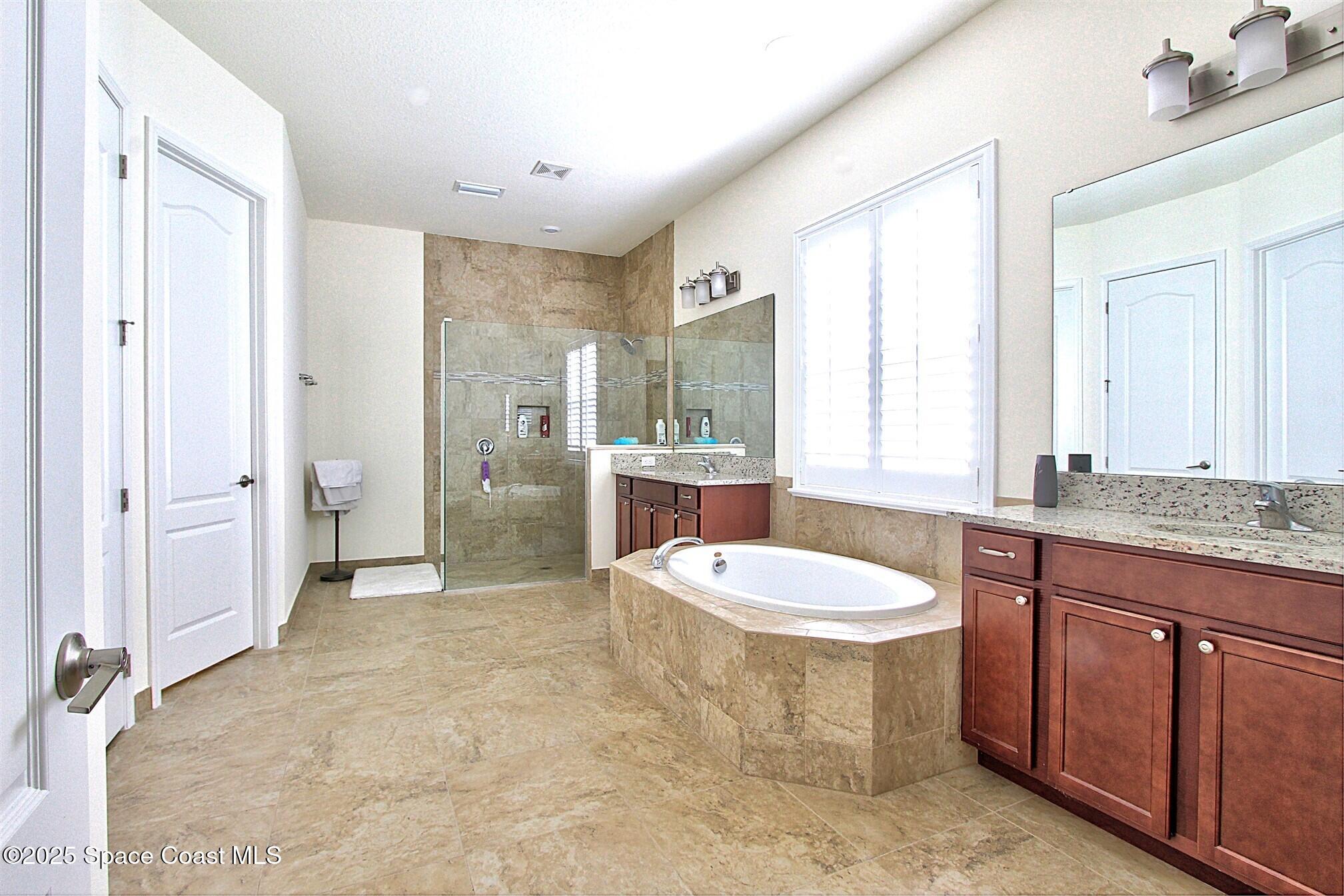 2542 Chapel Bridge Lane Melbourne, FL 32940 - Photo 24 of 44 a bathroom with a sink a toilet and shower