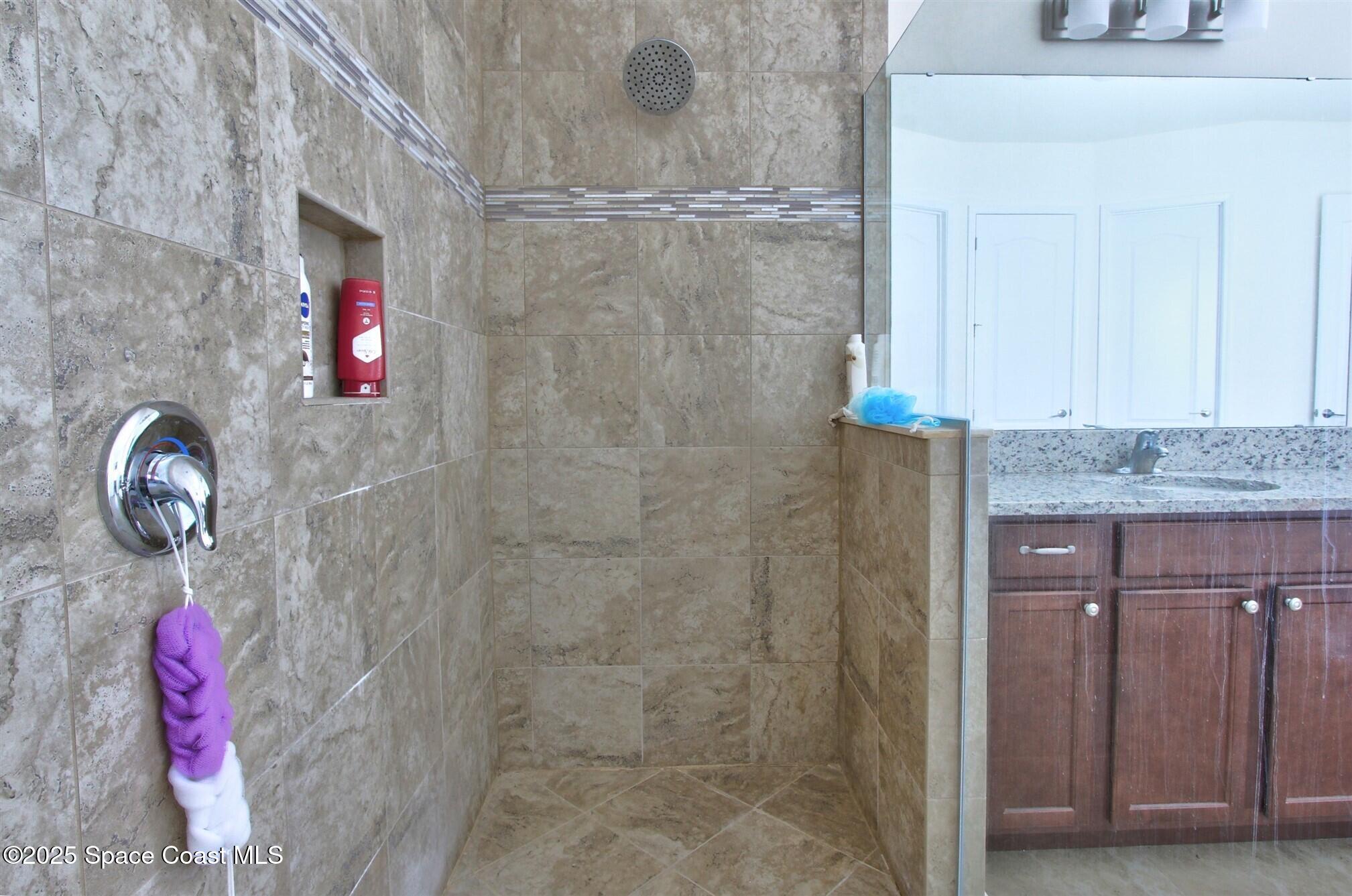 2542 Chapel Bridge Lane Melbourne, FL 32940 - Photo 26 of 44 a bathroom with a shower