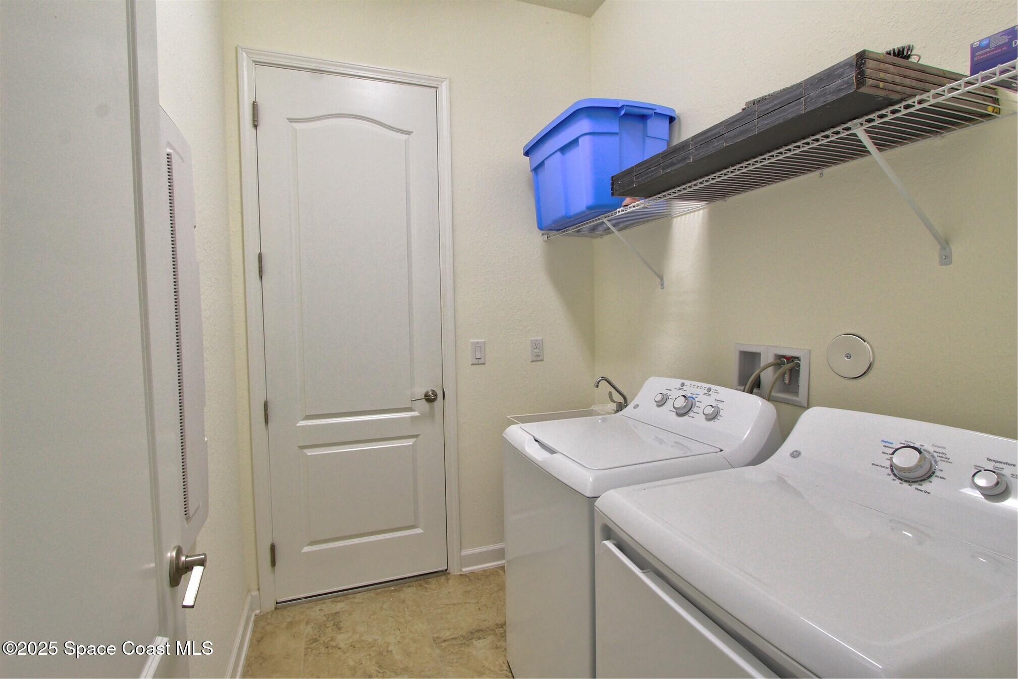2542 Chapel Bridge Lane Melbourne, FL 32940 - Photo 28 of 44 a utility room with dryer and washer