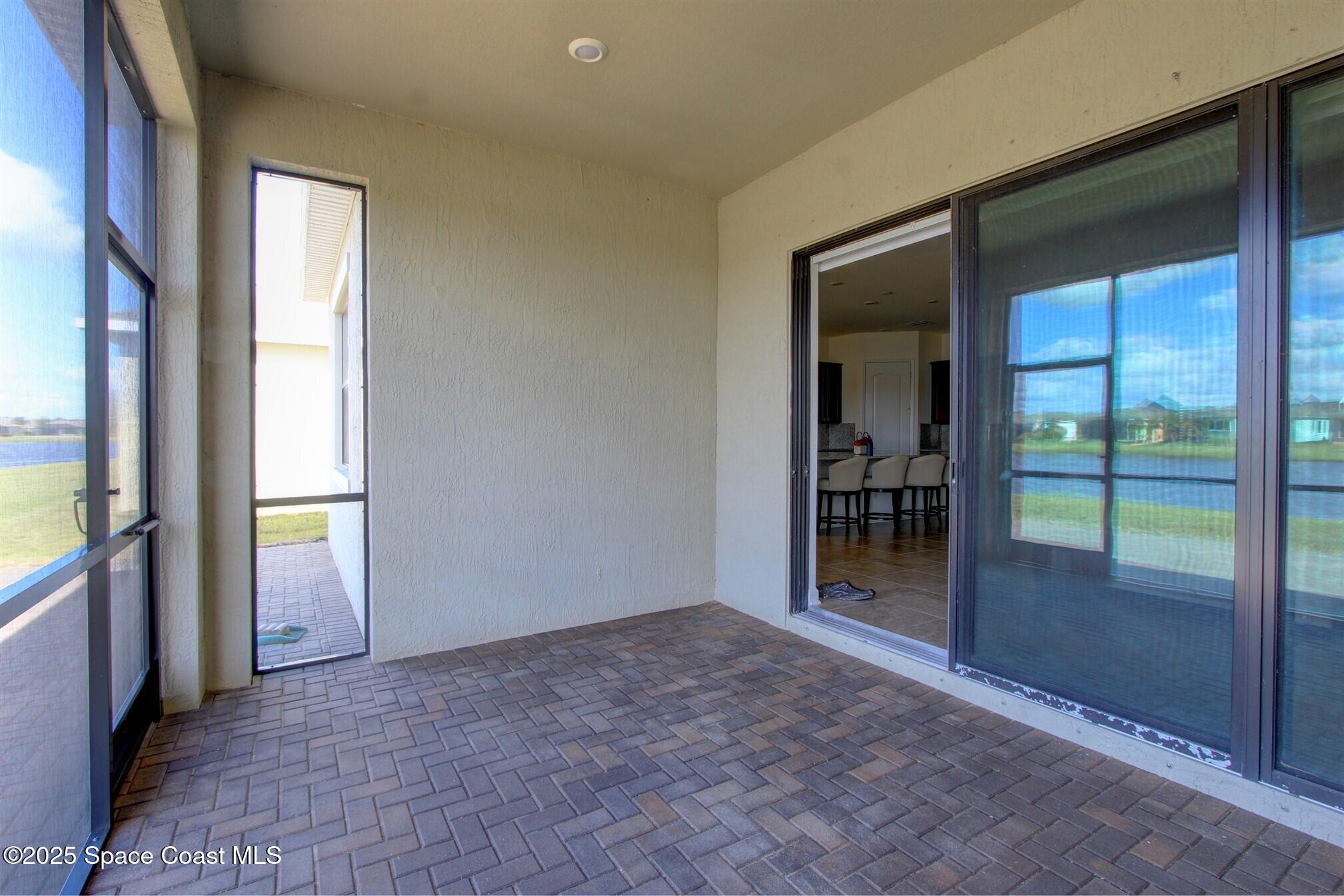 2542 Chapel Bridge Lane Melbourne, FL 32940 - Photo 33 of 44 wooden floor and window in an empty room