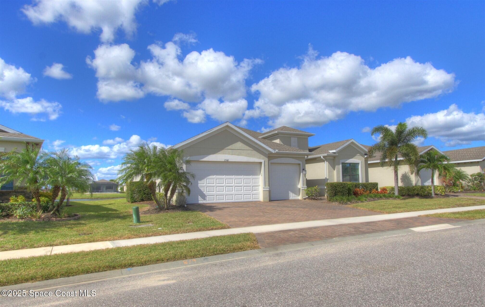 2542 Chapel Bridge Lane Melbourne, FL 32940 - Photo 38 of 44 a view of a house with a big yard