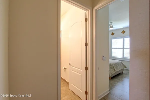 a view of bedroom with a bed and a window