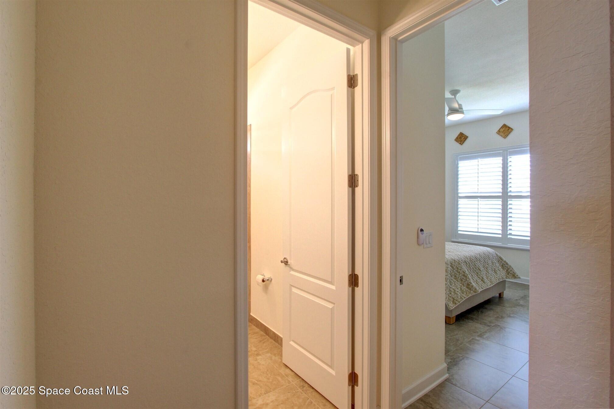2542 Chapel Bridge Lane Melbourne, FL 32940 - Photo 4 of 44 a view of bedroom with a bed and a window