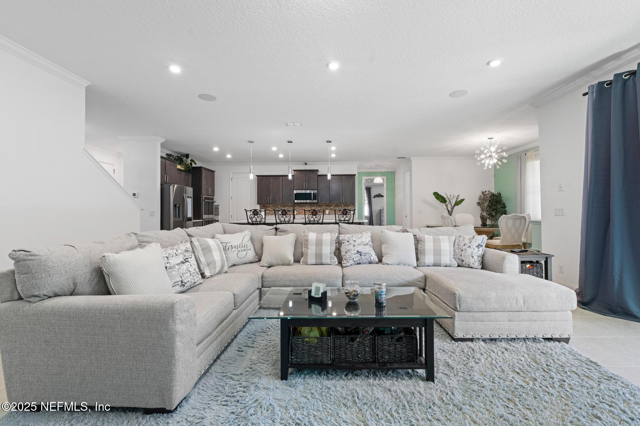 1465 Lake Foxmeadow Road Middleburg, FL 32068 - Photo 14 of 45 a living room with furniture and a view of kitchen