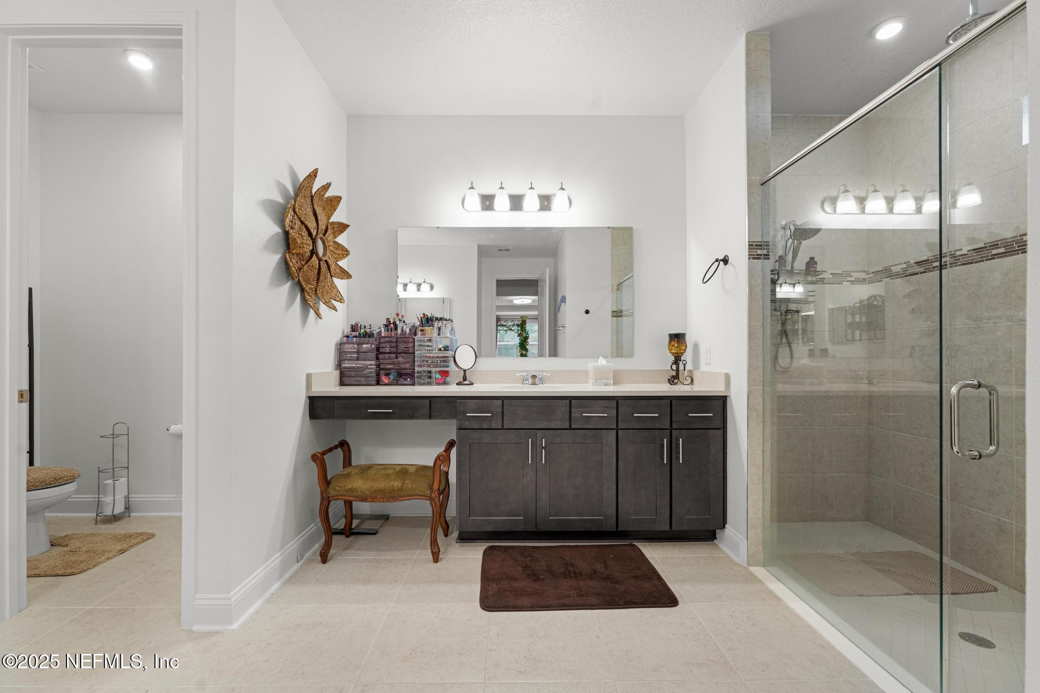 1465 Lake Foxmeadow Road Middleburg, FL 32068 - Photo 21 of 45 a bathroom with a sink and a mirror