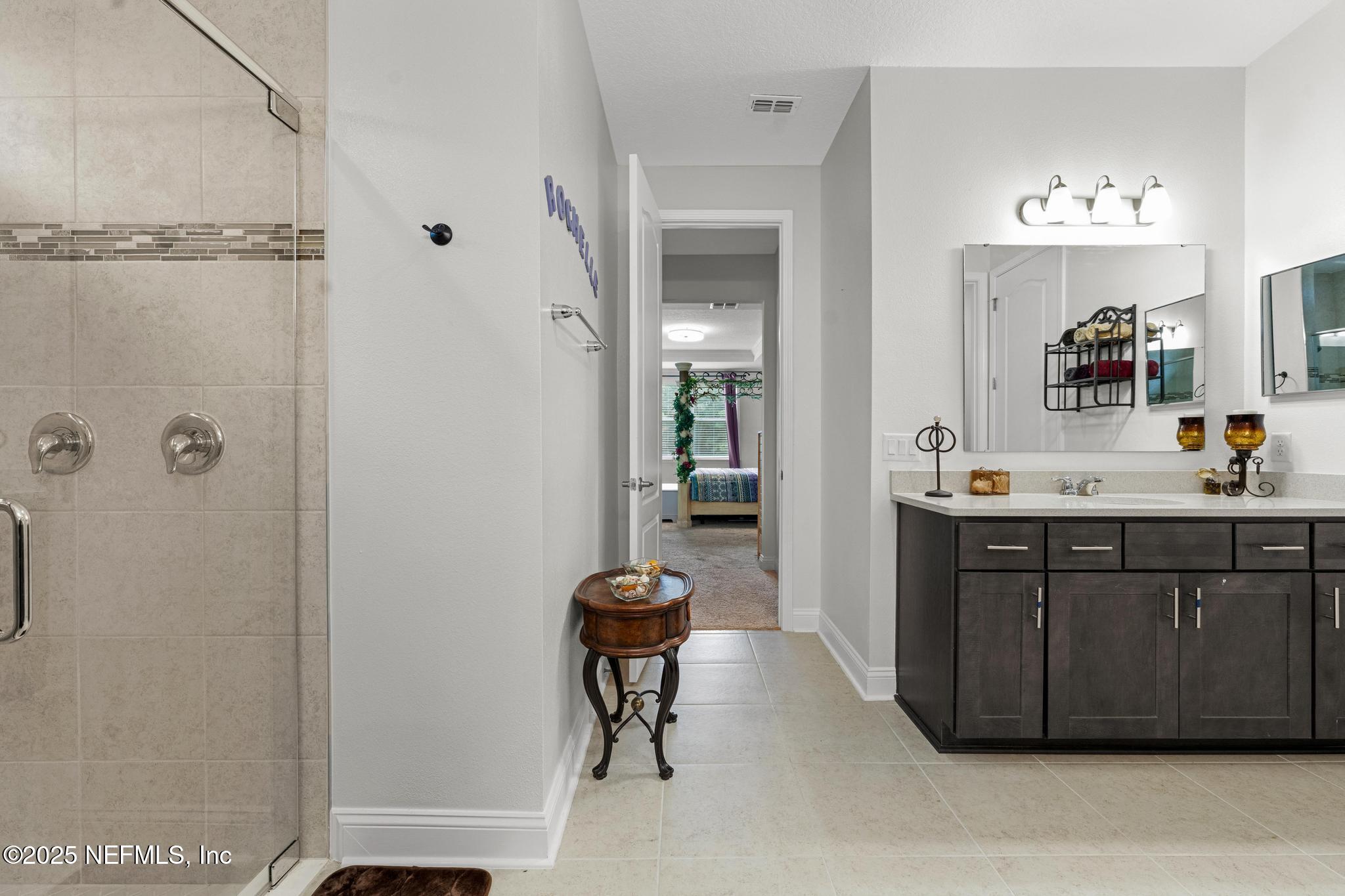 1465 Lake Foxmeadow Road Middleburg, FL 32068 - Photo 23 of 45 a bathroom with a sink vanity and a mirror