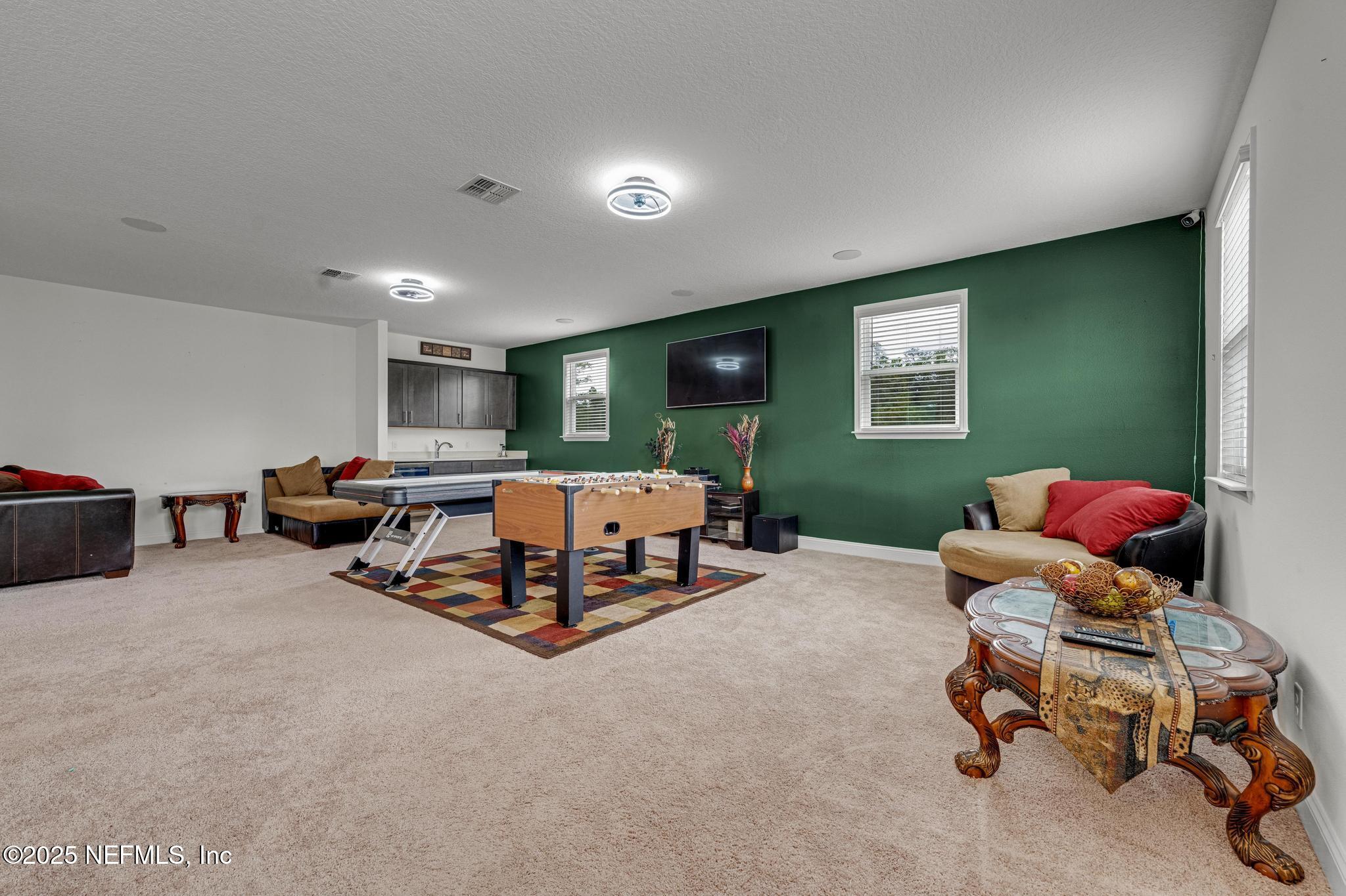 1465 Lake Foxmeadow Road Middleburg, FL 32068 - Photo 24 of 45 a bedroom with furniture and a window