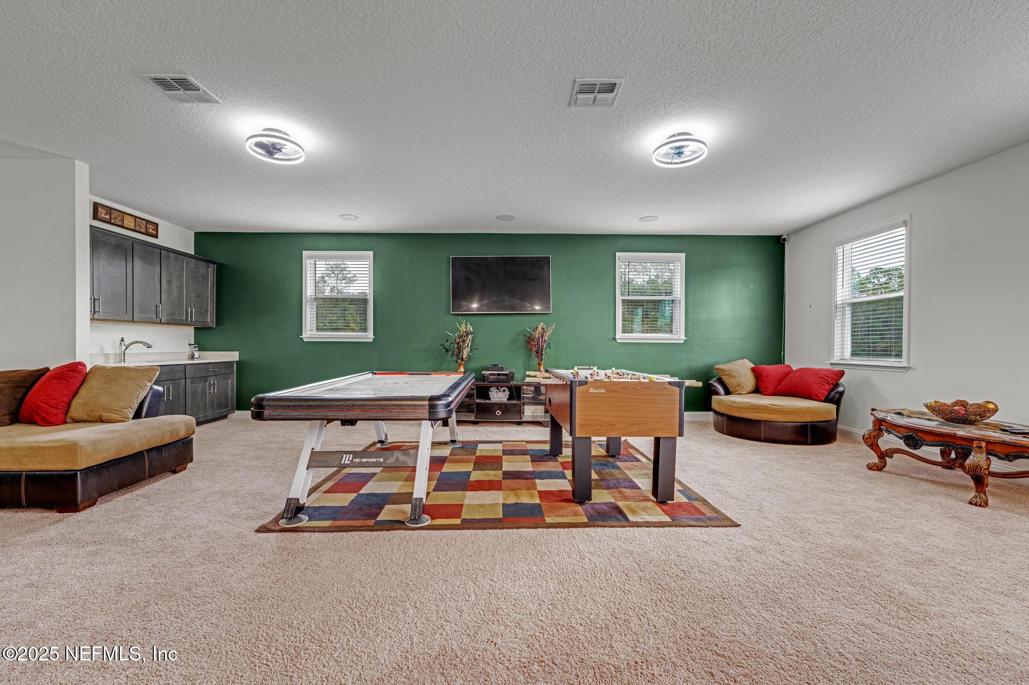 1465 Lake Foxmeadow Road Middleburg, FL 32068 - Photo 25 of 45 a living room with furniture gym equipment and a window