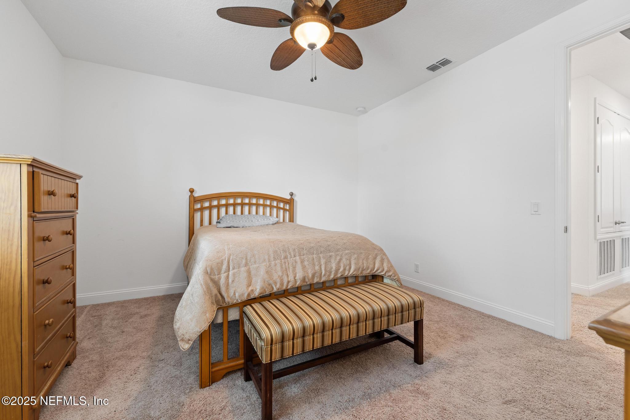 1465 Lake Foxmeadow Road Middleburg, FL 32068 - Photo 34 of 45 a bedroom with a bed and a ceiling fan