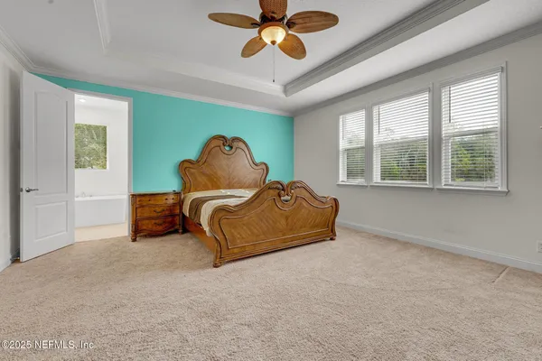 a bed room with a bed and a window