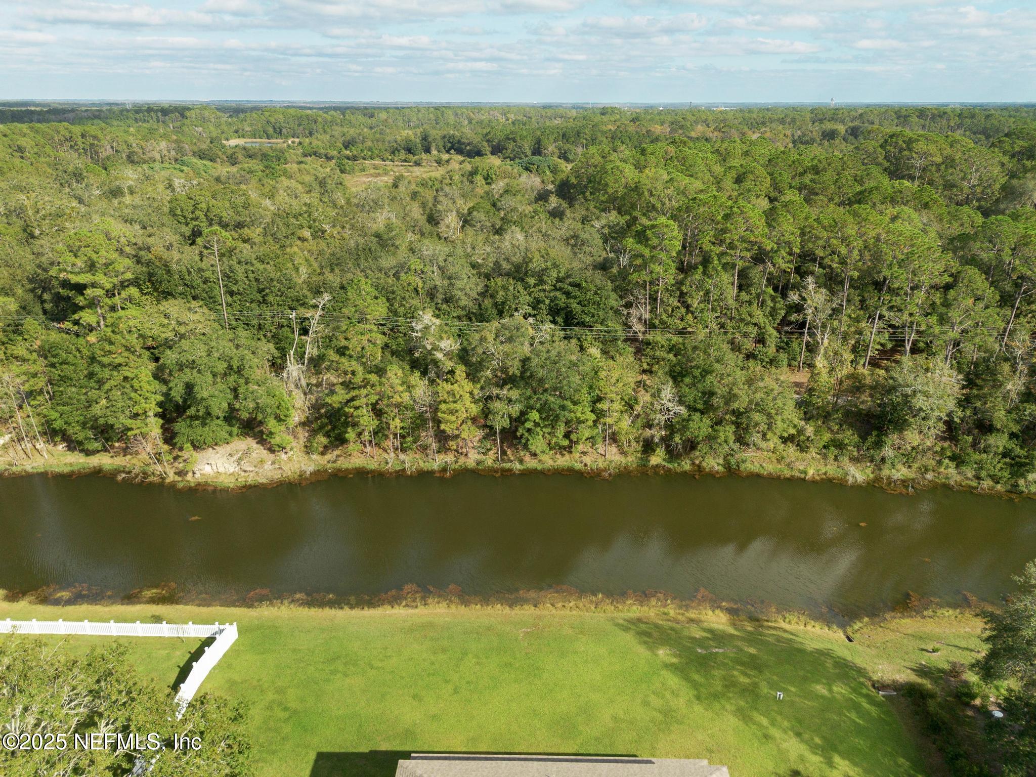 1465 Lake Foxmeadow Road Middleburg, FL 32068 - Photo 43 of 45 an aerial view of residential houses with outdoor space and swimming pool