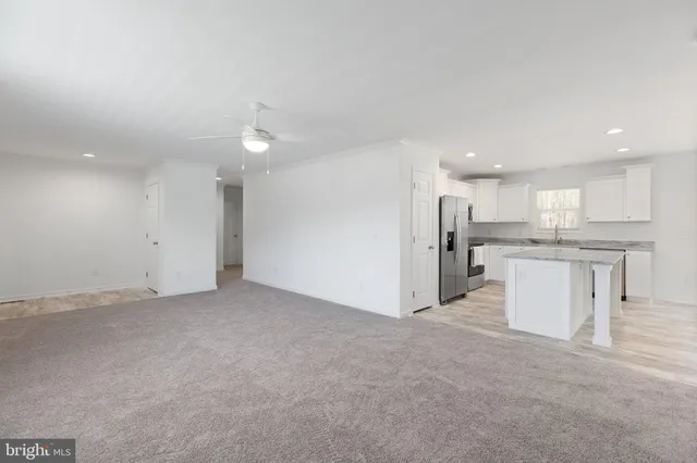 a view of a kitchen with a sink and cabinets