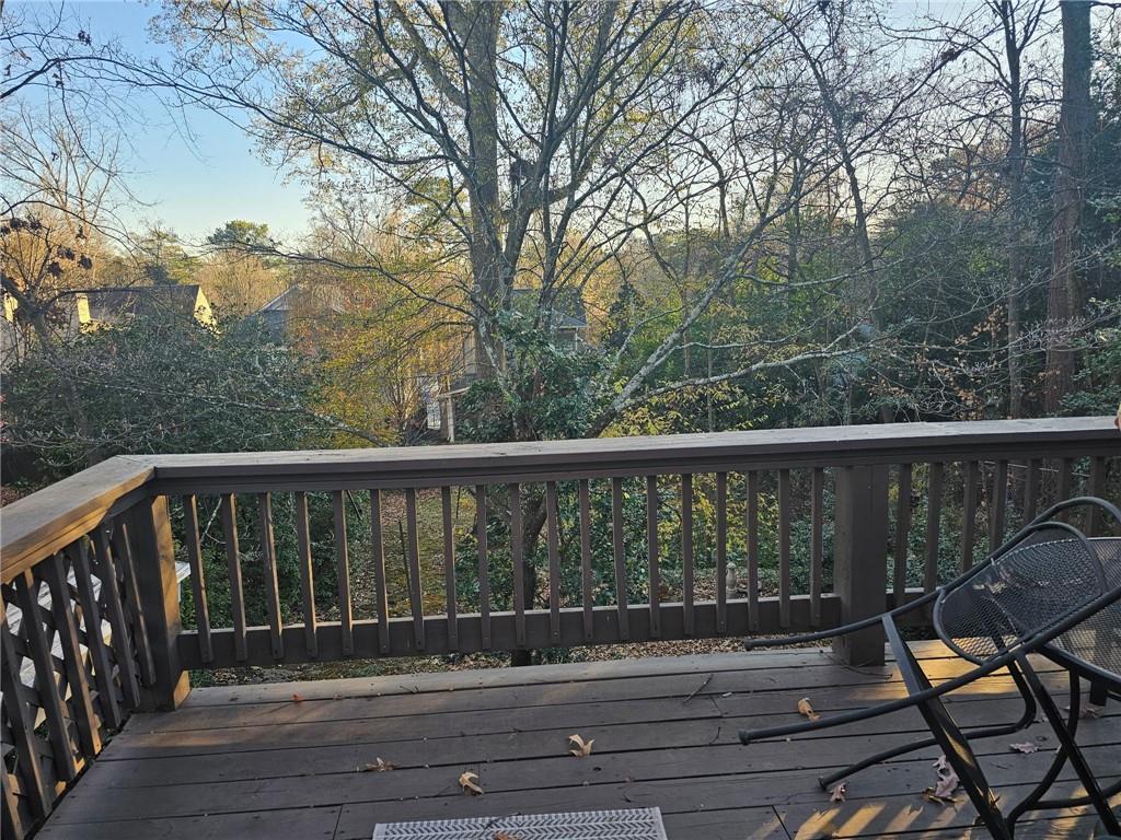 245 Lindbergh Drive Northeast Atlanta, GA 30305 - Photo 12 of 13 a roof deck with wooden floor and fence