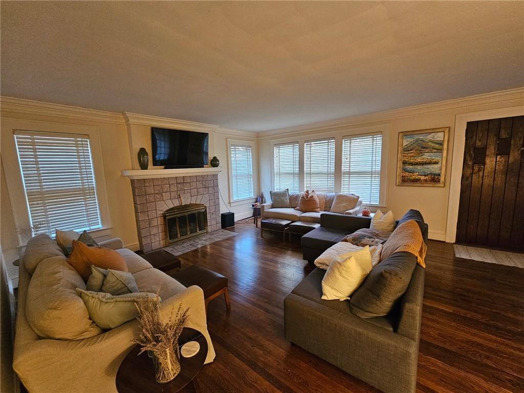 245 Lindbergh Drive Northeast Atlanta, GA 30305 - Photo 2 of 13 a living room with furniture fireplace and a window