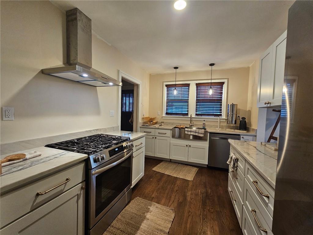 245 Lindbergh Drive Northeast Atlanta, GA 30305 - Photo 3 of 13 a kitchen with granite countertop a stove top oven and sink