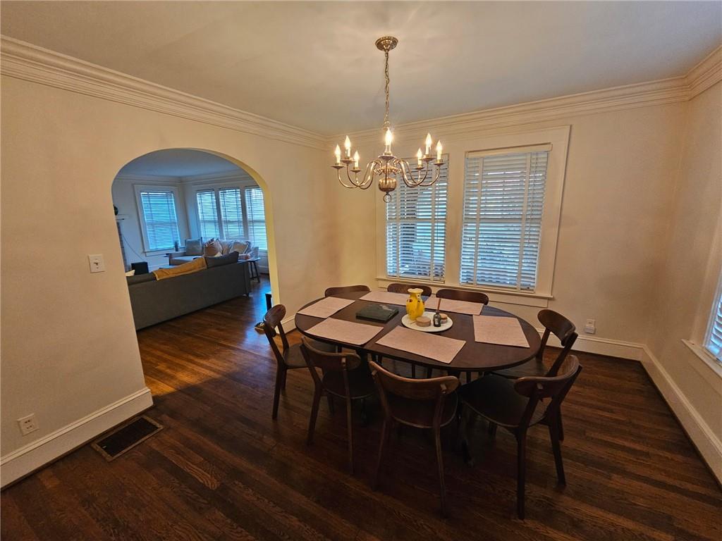 245 Lindbergh Drive Northeast Atlanta, GA 30305 - Photo 5 of 13 a view of a dining room with furniture window and wooden floor