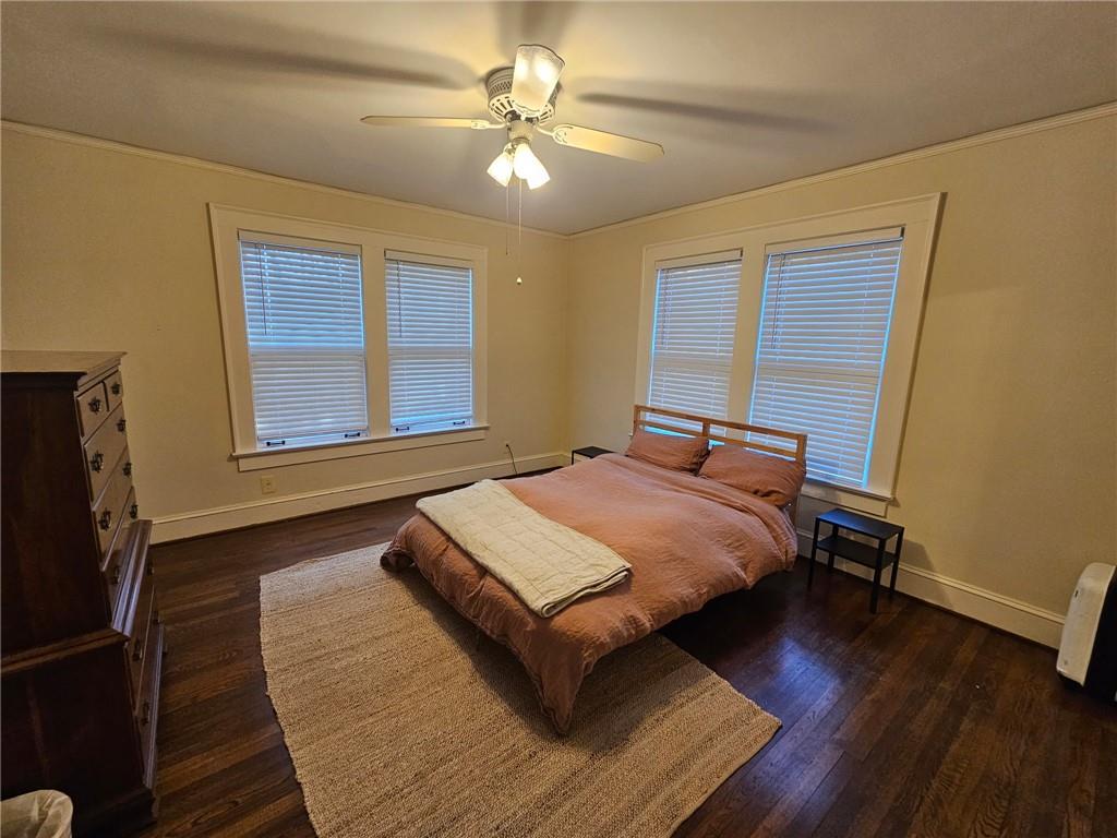 245 Lindbergh Drive Northeast Atlanta, GA 30305 - Photo 7 of 13 a bed sitting in a bedroom next to a window