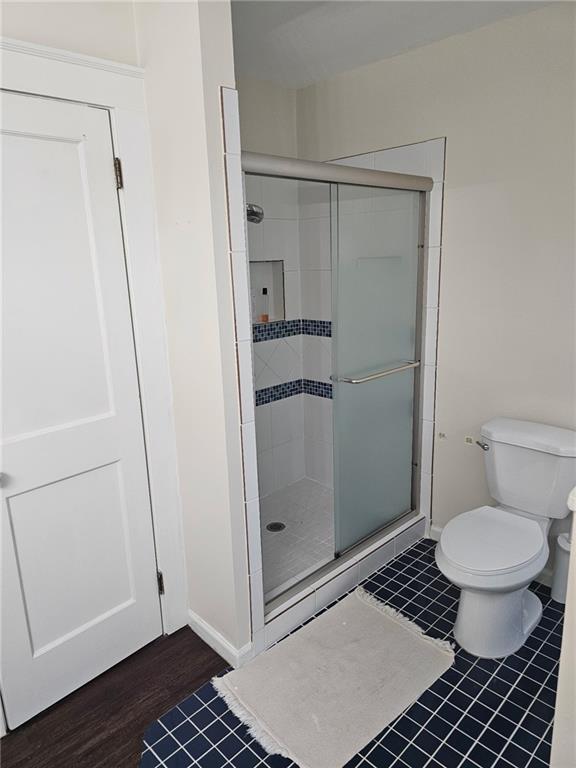 245 Lindbergh Drive Northeast Atlanta, GA 30305 - Photo 10 of 13 a bathroom with a shower and a toilet
