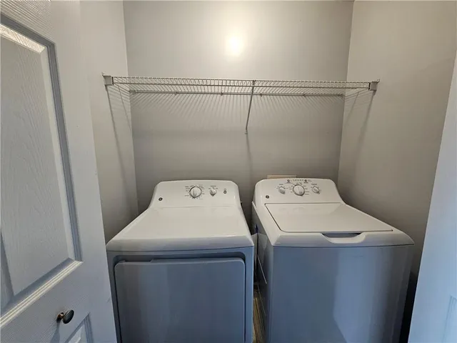 a utility room with dryer and washer