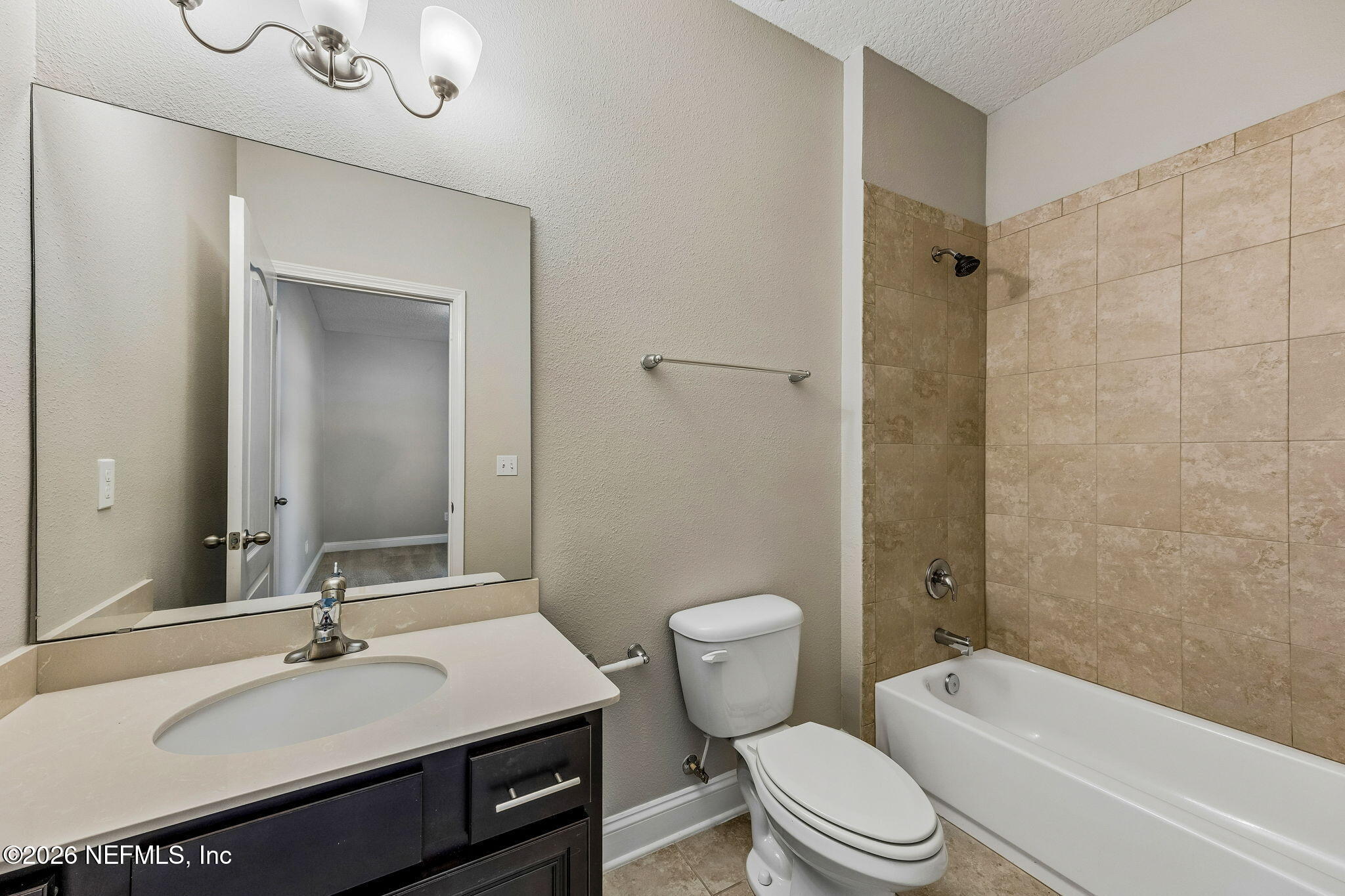 12198 Ridge Crossing Way Jacksonville, FL 32226 - Photo 34 of 67 a bathroom with a sink a toilet a mirror and shower
