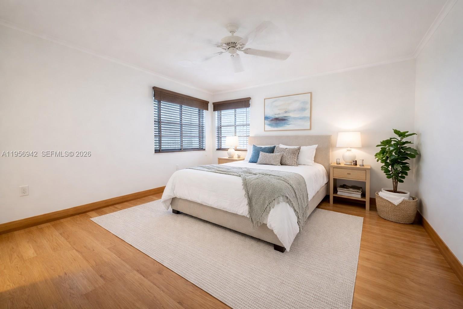 3920 Inverrary Boulevard, Unit 608C Lauderhill, FL 33319 - Photo 11 of 14 a bedroom with a bed and window