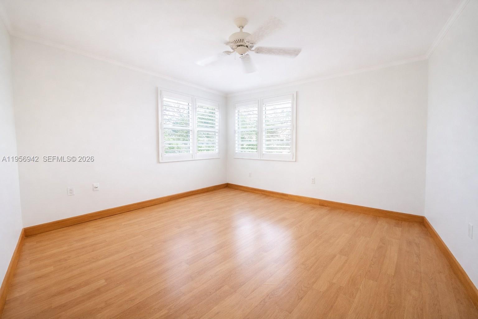 3920 Inverrary Boulevard, Unit 608C Lauderhill, FL 33319 - Photo 13 of 14 an empty room with a window and a ceiling fan