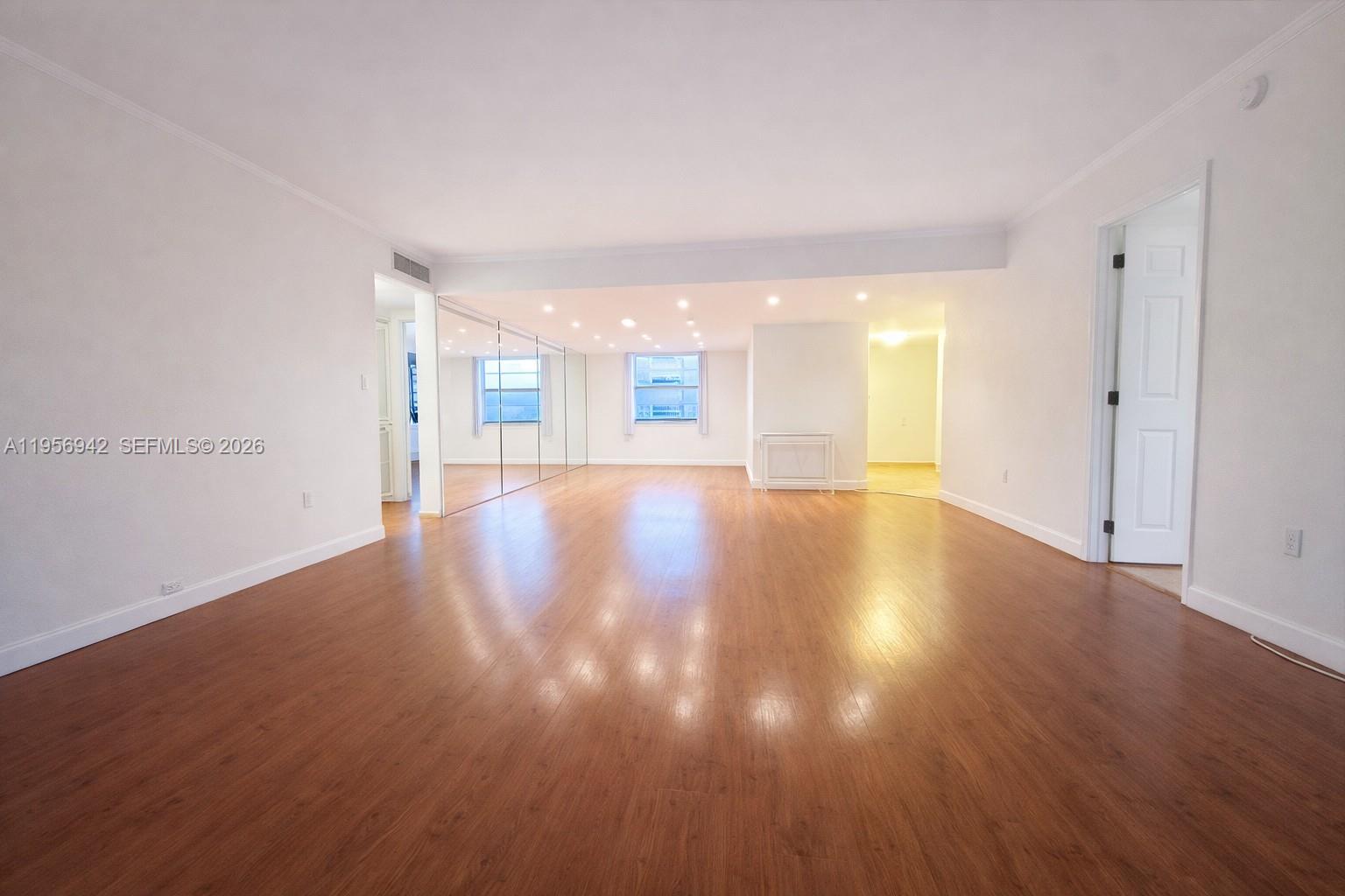 3920 Inverrary Boulevard, Unit 608C Lauderhill, FL 33319 - Photo 3 of 14 a view of a big room with wooden floor and windows