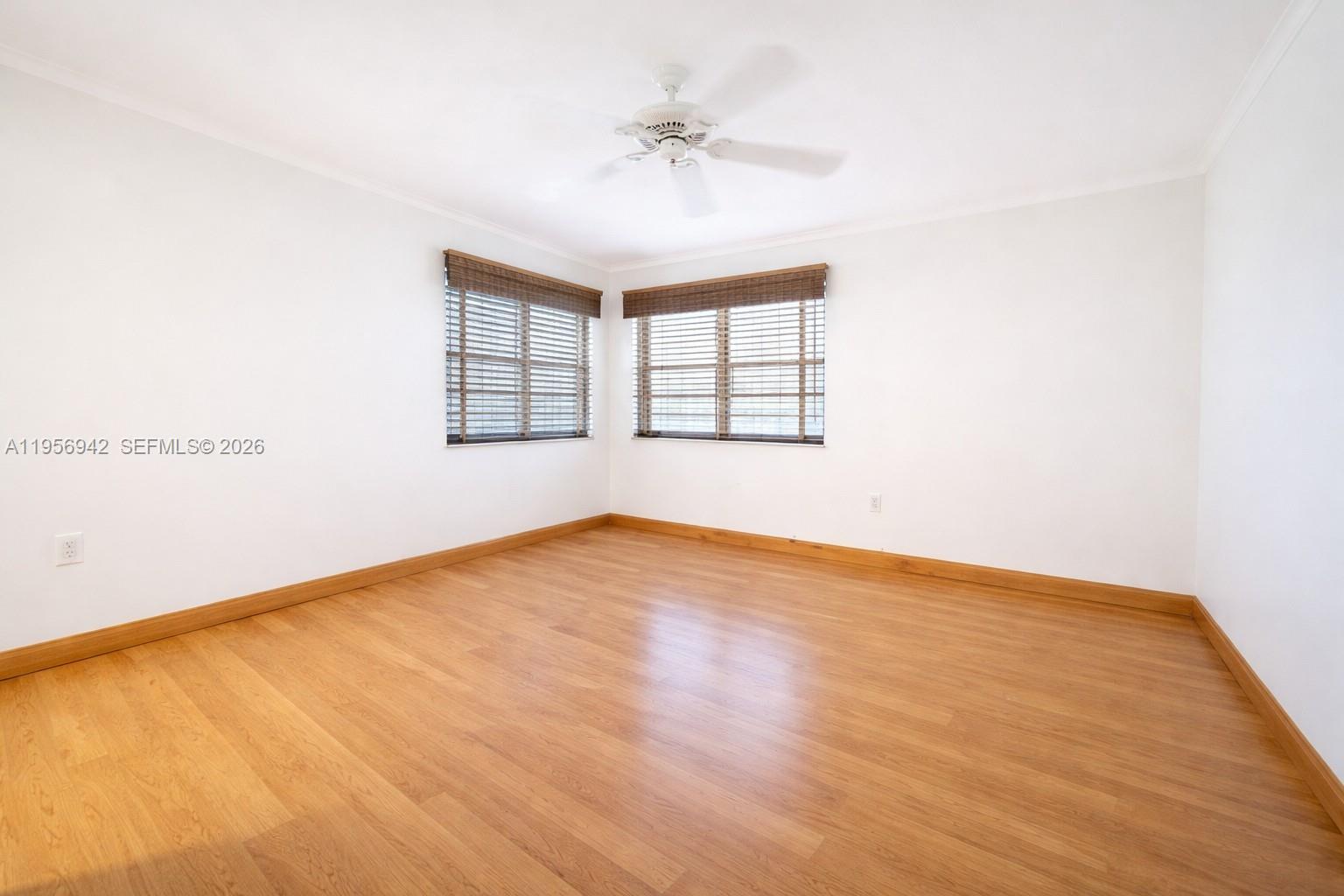3920 Inverrary Boulevard, Unit 608C Lauderhill, FL 33319 - Photo 10 of 14 an empty room with a window and a ceiling fan