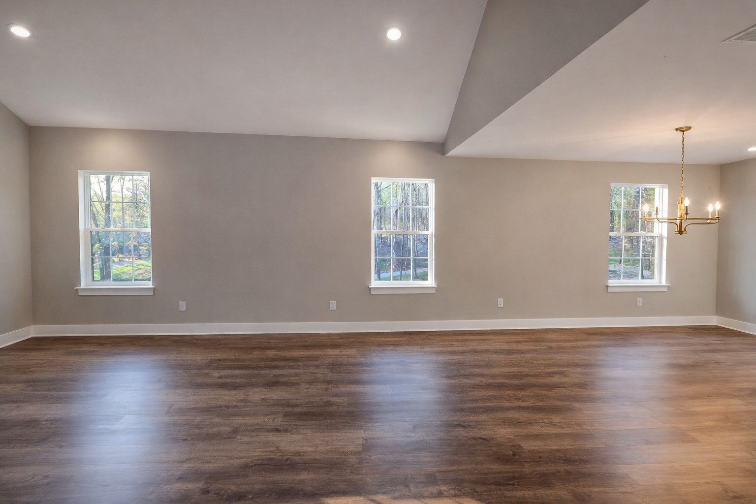 4603 Chapel Hill Road Southside, TN 37171 - Photo 12 of 25 an empty room with wooden floor and windows