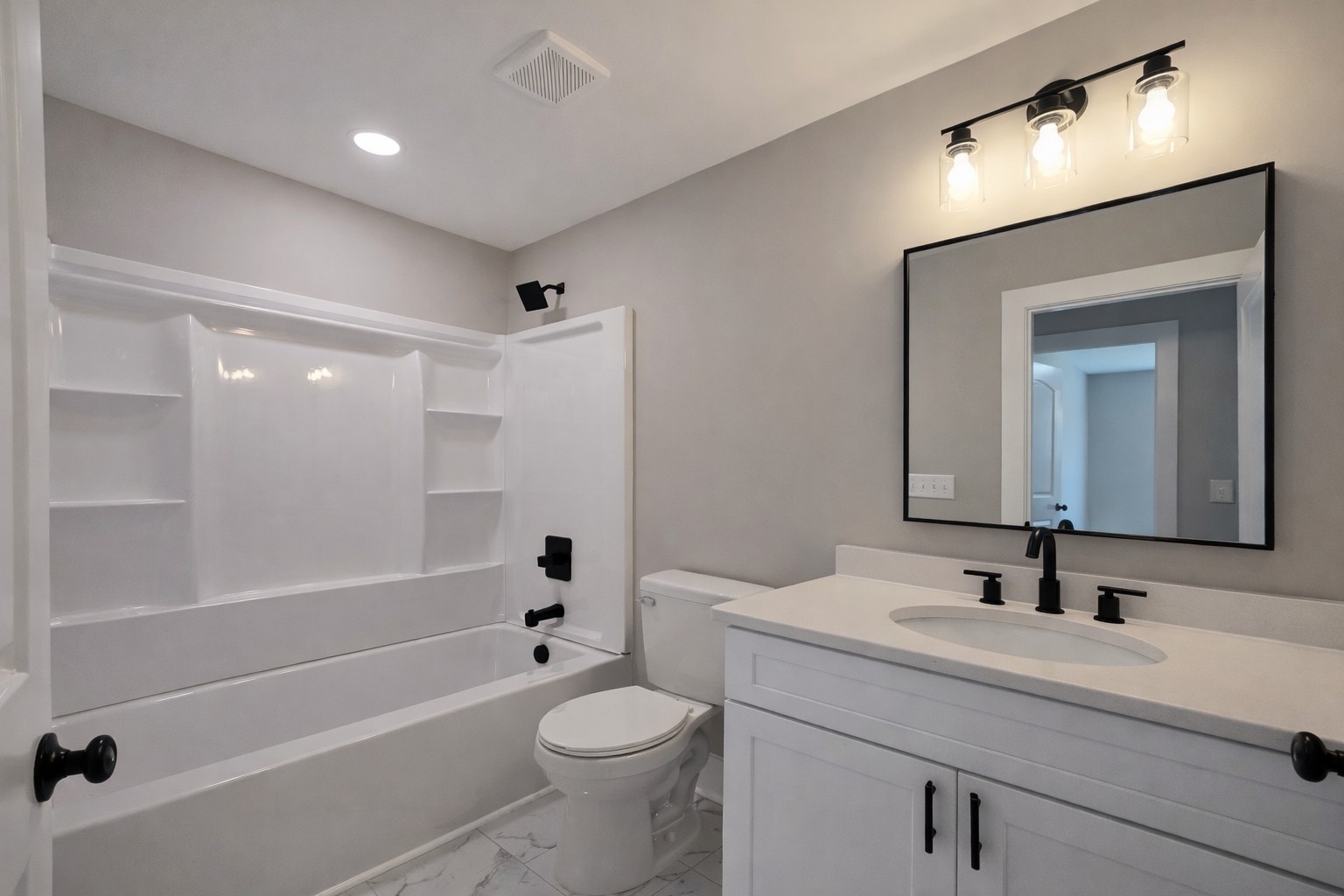 4603 Chapel Hill Road Southside, TN 37171 - Photo 14 of 25 a bathroom with a toilet a sink a mirror a bathtub and vanity