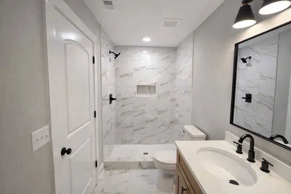 a bathroom with a sink and a mirror