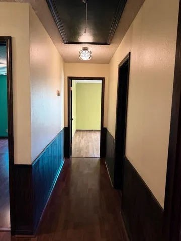 a view of gallery with wooden floor