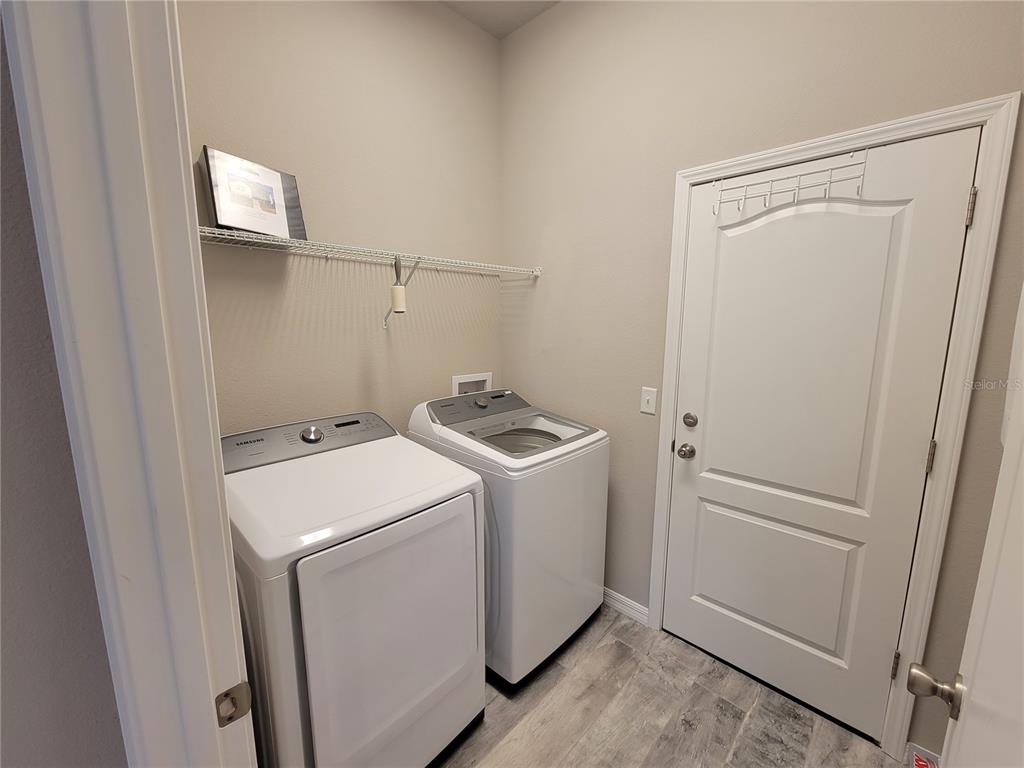 6323 Southwest 47th Terrace Gainesville, FL 32608 - Photo 22 of 25 a utility room with dryer and washer