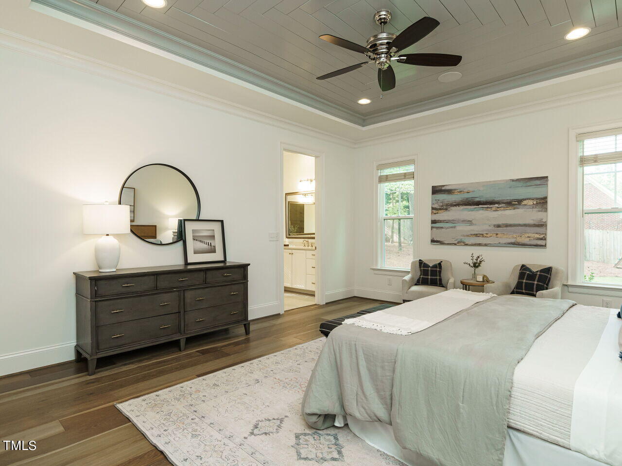 4405 Boxwood Road Raleigh, NC 27612 - Photo 23 of 58 a bedroom with a bed and a dresser