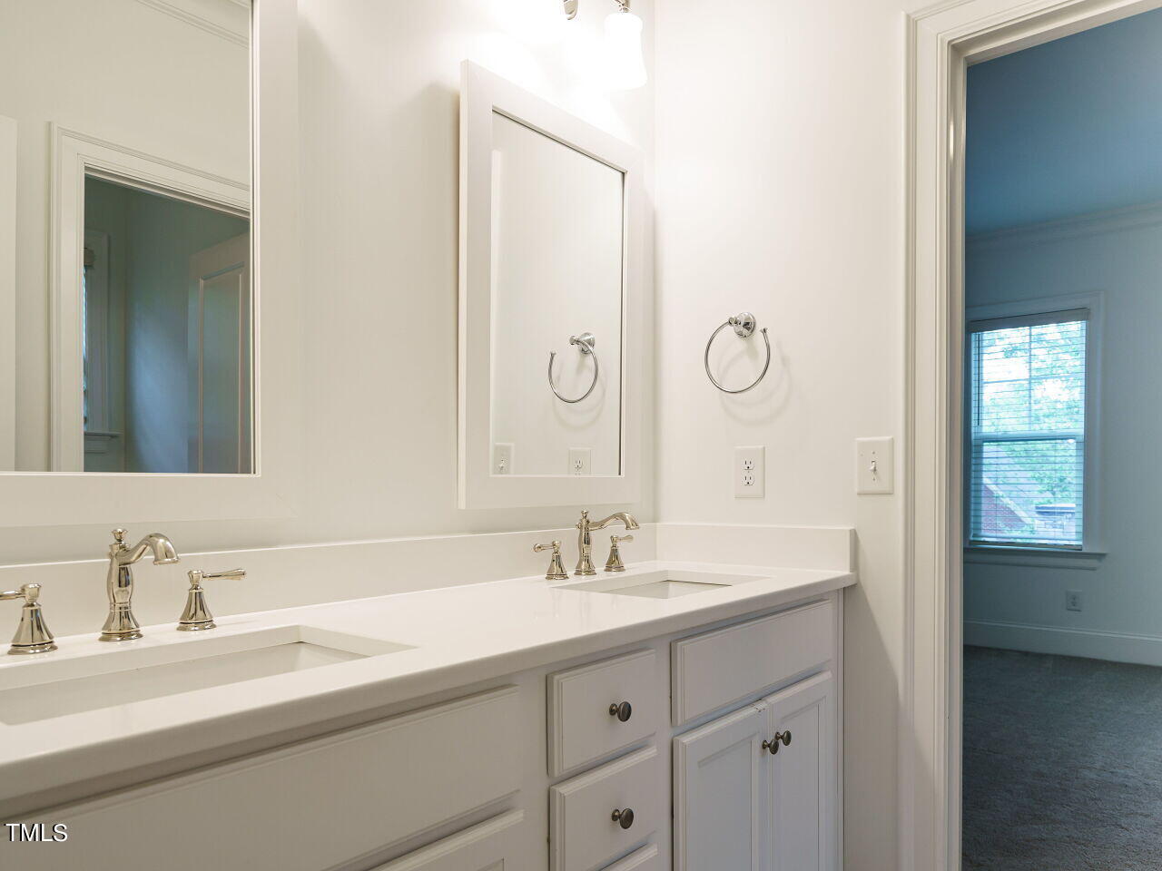 4405 Boxwood Road Raleigh, NC 27612 - Photo 30 of 58 a bathroom with a sink and a mirror